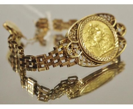 A George IV full sovereign, 1917 mounted in a 9ct gold gate bracelet.&nbsp;19.4g gross