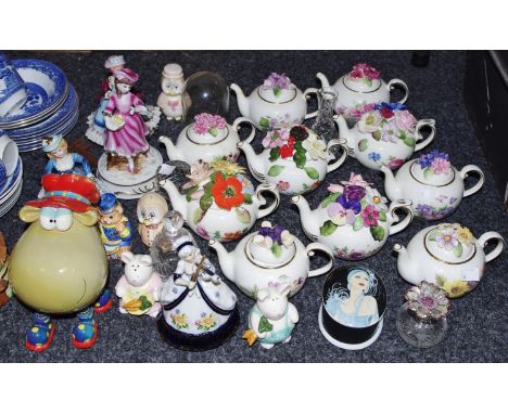 A set of ten Royale Stratford for Compton and Woodhouse Country Cottage teapots, including Viola Tricolor, Spring, Summer, Sw