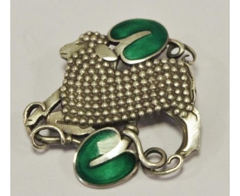 Georg Jensen style a Danish silver and enamel pierced brooch, a lamb with green enamel leaves above and below, stamped 925 ST