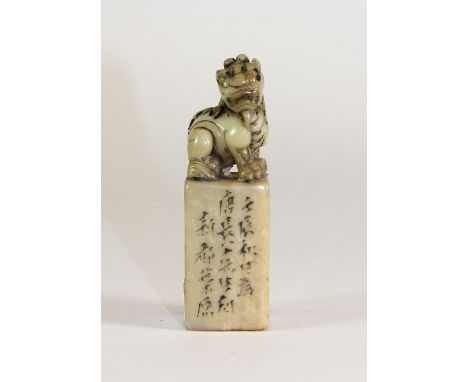 A small early 20th century carved white jade / hardstone seal mounted with a young dragon, H 7cm
