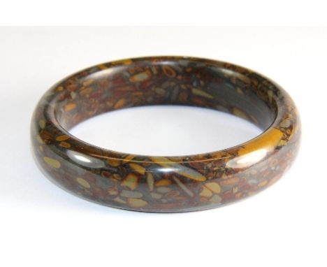 An unusual polished hardstone bangle (Internal Dia 6.1 cm)