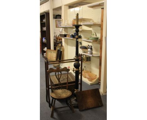 A painted carved wooden standard lamp mahogany towel rail chair, a brass covered coal box and walnut veneered book rest
