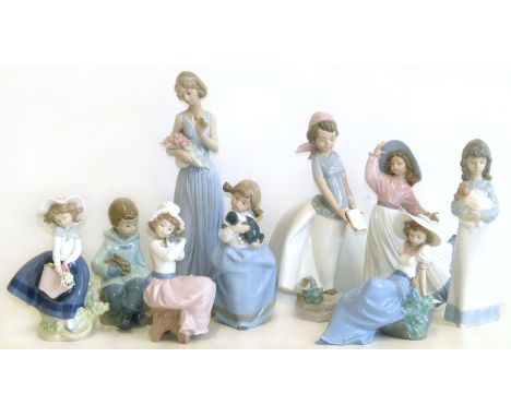 Lladro figure and eight Nao figures Condition reports are not available for our Interiors Sale