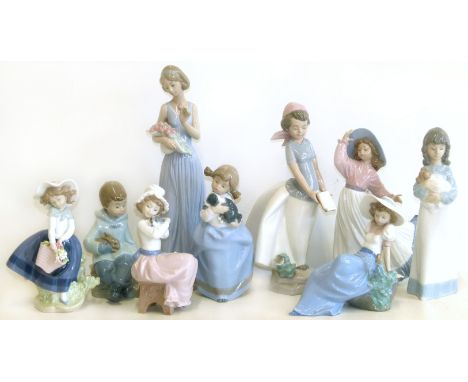 Lladro figure and eight Nao figures Condition reports are not available for our Interiors Sale