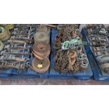 The contents of a pallet of assorted rachet straps/ lifting chains.