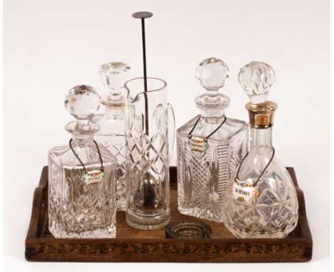 A cut glass decanter and stopper with silver mounts, 30cm high, three square cut glass spirit decanters and stoppers, three e