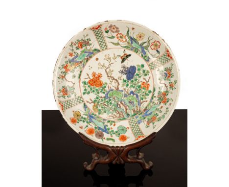 A large famille verte saucer-shaped dish painted flowers and butterflies, of the Kangxi period, 38cm diameter/see illustratio