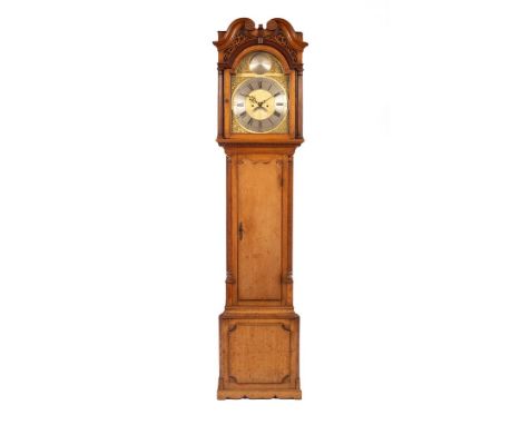 A late 18th Century oak longcase clock with scroll and fret cornice and fluted columns to the hood, the trunk with fluted col