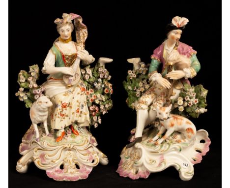 A pair of Continental porcelain candlestick figures of shepherd and shepherdess musicians, in the Derby style, 24cm high/Prov