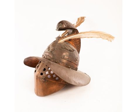 A Roman style gladiators copper helmet, with eagle to the front, snails to the sides and a pierced visor, approximately 38cm 