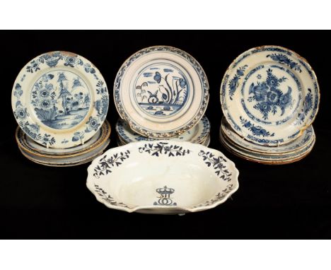 Seventeen Dutch and English blue and white delftware plates (damages) and a shaving bowl probably French, 18th Century/Proven