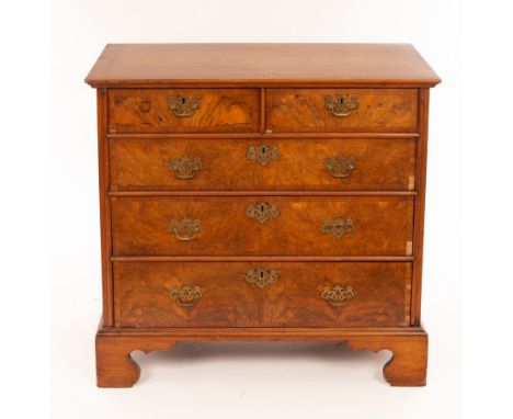 An early 18th Century walnut chest of three long and two short drawers, the fronts cross banded, (originally a chest on stand