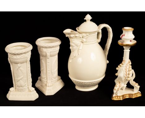 A pair of Victorian Parian cylindrical vases applied trophies on a triangular base, a glazed Parian pot and cover with mask s