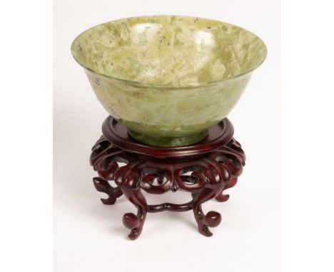 A jade bowl, 12.5cm diameter CONDITION REPORT: Condition information is not usually provided in the description of the lot bu