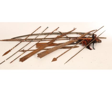 A quantity of tribal weapons, to include a bow, polychrome and barbed arrows, machete and spear, the longest 123cm  CONDITION