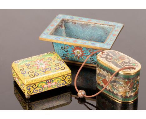 Three 19th/20th Century cloisonné vessels to include a small planter decorated scrolling lotus, 14.5cm long, a yellow box dec