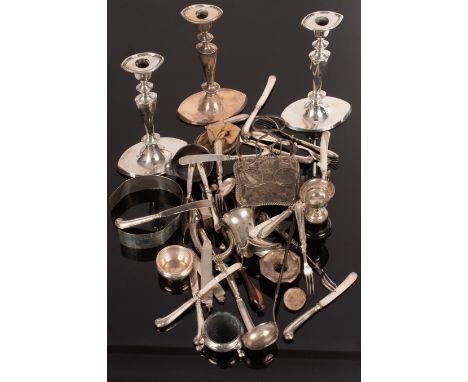 Three silver candlesticks, a silver cruet stand (lacking bottles), a silver mount from a claret jug and various broken or dam