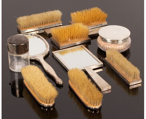 An Art Deco silver dressing table set, Finnigans Ltd., London 1942, of five pieces and sundry silver backed dressing table it