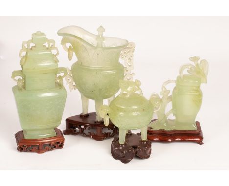 Four pieces of celadon jade carving, 20th Century, in archaistic Zun style of tapering square shape, depicting dragons with e