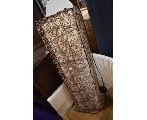 A wicker work floor lamp
