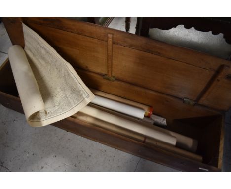 A vintage wooden box containing a selection of ordnance survey or similar plans including marine interest