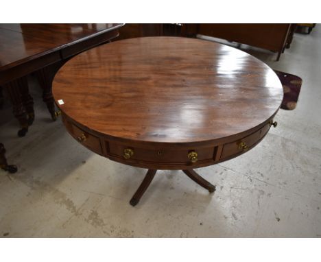 A nice quality late 19th or early 20th Century Regency revival mahogany drum table having alternating pull and hinger drawers