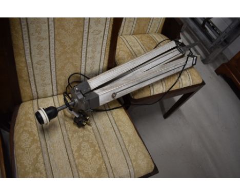 A reproduction tripod style standard lamp