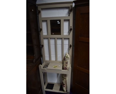 An Edwardian hallway cloak or coat stand having mirror back