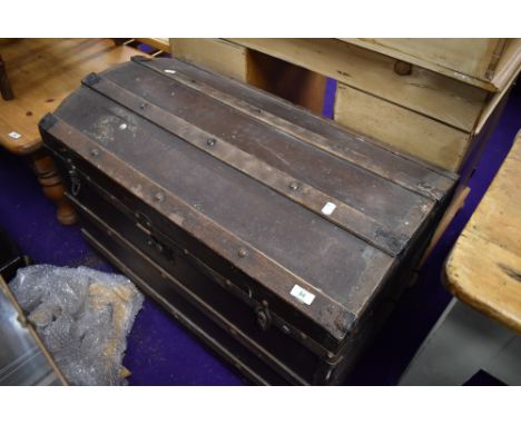 A dome top travel trunk or bedding box
