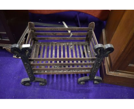 A cast iron ingle nook open fire grate 49cm wide by 34cm deep