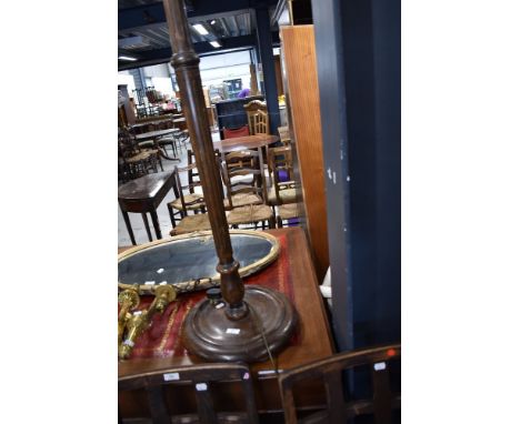 A wooden standard lamp base