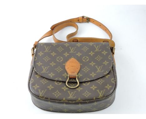 A Louis Vuitton cross-body bag, monogram pattern with light tan leather strap and buckle loop. 