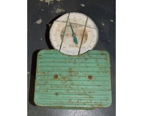 A set of bathroom scales, manufactured by Fuji, 25-100kg, green painted with a cream dial, W. 27cm.