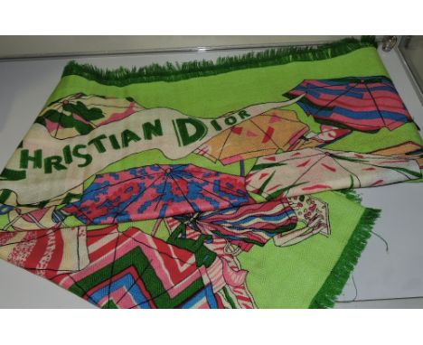A Christian Dior wool scarf, printed with a beach parasol scene on a green ground.