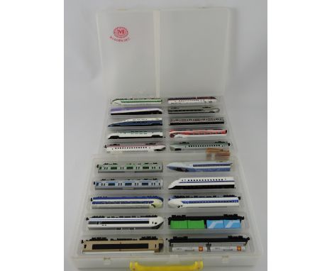 A collection of 20 Japanese Die-Cast scale models of bullet trains, passenger coaches and goods wagons.