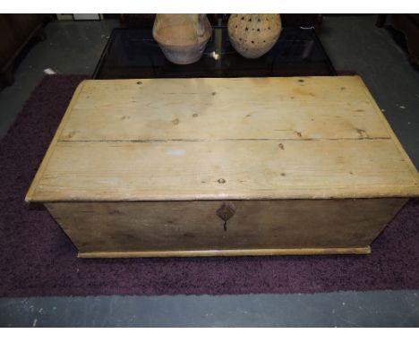 A 19th Century continental pine trunk on square tapered feet, W.120cm.