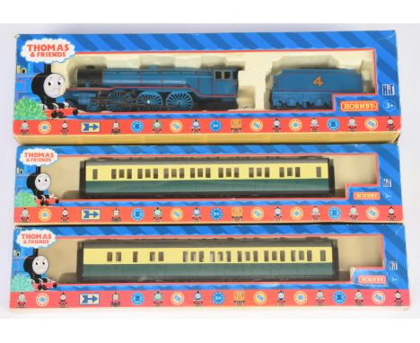 Hornby (China) group of Thomas &amp; Friends items comprising of R383 Gordon The Big Blue Engine, R120 Gordon Composite Coach