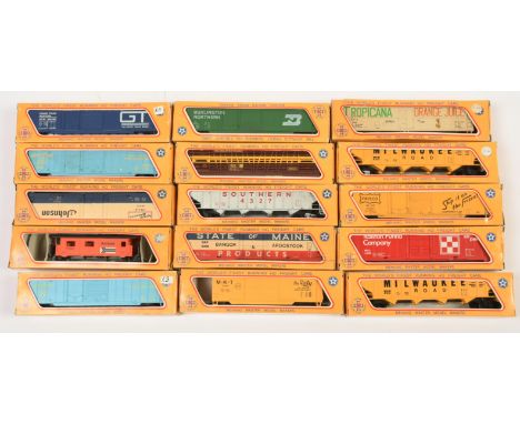 Mehano HO. Group of boxed wagons. To include "Amtrak" caboose, "Milwaukee Road" stock car, "Milwaukee Road" 4 bay hopper, plu