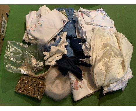 A QUANTITY OF VINTAGE GLOVES HATS AND TABLE CLOTHS ETC 