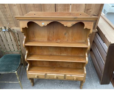 A MODERN OPEN WALL SHELF ENCLOSING THREE DRAWERS 