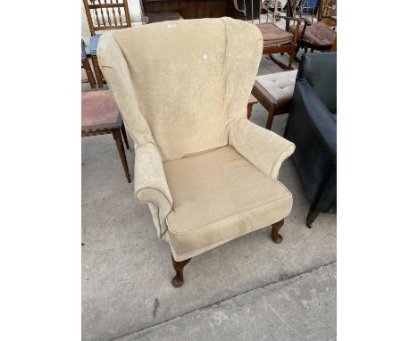 A PARKER KNOLL WINGED CHAIR ON CABRIOLE LEGS, MODEL PK.720 MK111 