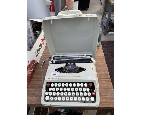 A SMITH-CORONA DELUXE TYPEWRITER 