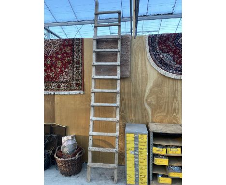 A VINTAGE 12 RUNG WOODEN LADDER 