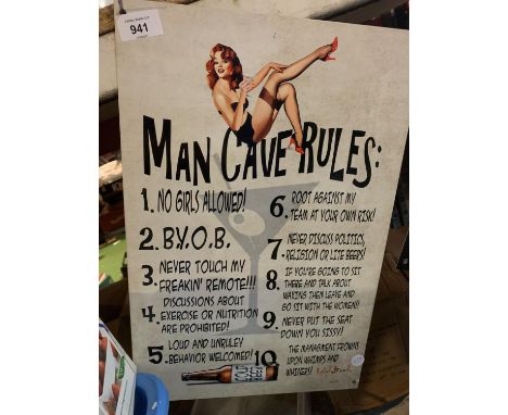 A VINTAGE STYLE METAL 'MAN CAVE RULES' SIGN 
