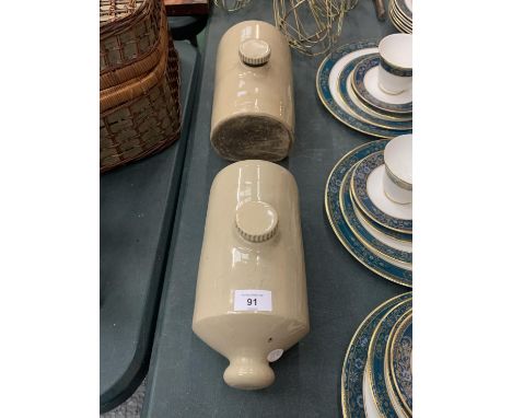 A PAIR OF VINTAGE EARTHENWARE HOT WATER BOTTLES 