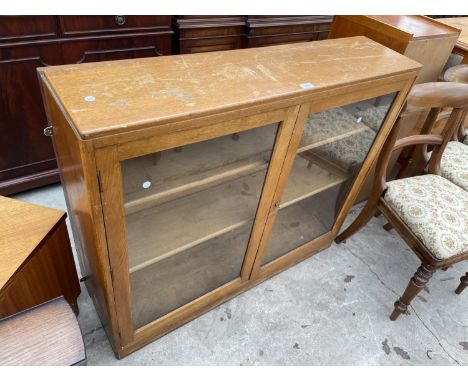 A LIGHT OAK TWO DOOR CABINET, 44.5" WIDE 