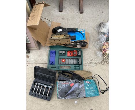 AN ASSORTMENT OF TOOLS TO INCLUDE AN ELECTRIC SANDER, CAR VAX AND ROUTER TIPS ETC 