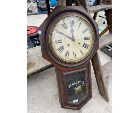 A VINTAGE REGULATOR WALL CLOCK WITH KEY 