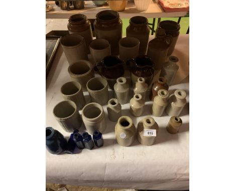 A LARGE QUANTITY OF VINTAGE EARTHENWARE JARS AND BOTTLES 