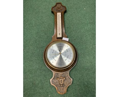 A CARVED OAK BAROMETER BY COMITTI OF LONDON 